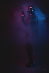Obraz premium Cyberpunk girl in the smoke in the neon lights background concept.
