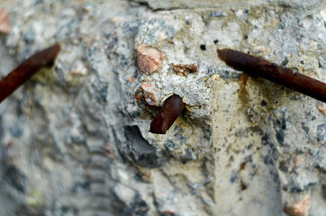 Rusty metal sticking out of concrete