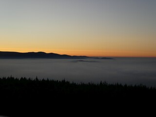 sunrise above the clouds of inversion i the valley