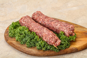 Raw minced beef kebab skewer