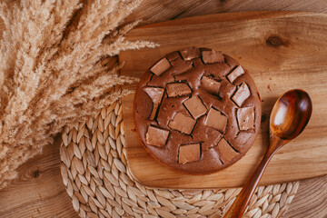 chocolate cake on a wooden background of the kitchen table