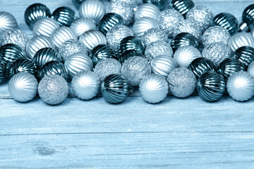 New Year Balls on blue wood background. Christmas background with colorful baubles. Happy New Year greeting card