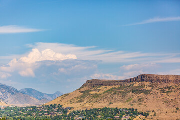 Fototapeta na wymiar Clouds fill the sky over Table Mountain, Golden, Colorado