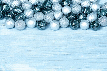 New Year Balls on blue wood background. Christmas background with colorful baubles. Happy New Year greeting card