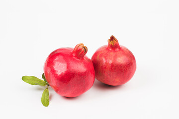 Pomegranate in composition in studio on white background