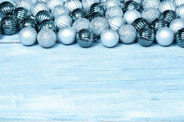 New Year Balls on blue wood background. Christmas background with colorful baubles. Happy New Year greeting card