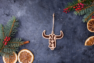 Symbol of the new year. A year of the bull. Wooden toys on Christmas trees in the form of beautiful bulls.