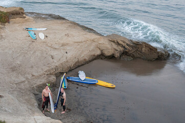 surfers on beach