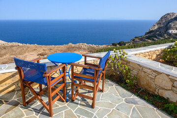 Relax coffee corner at the terrace overlooking the Aegean Sea. Folegandros island, Cyclades, Greece