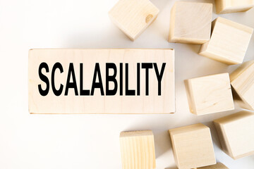 scalabillity. TEXT ON a wooden block on a light background