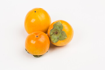 Kinglet persimmon, fall fruits in studio
