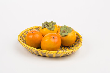 Kinglet persimmon, fall fruits in studio