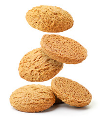 Oatmeal cookies flies and falls on a pile on a white background, levitating cookies. Isolated