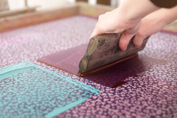 A detailed clover design is printed by hand with a squeegee and a professional silk-screen for...
