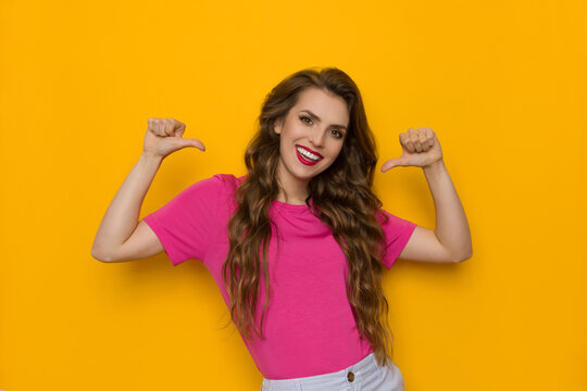 Confident Young Woman Is Pointing At Herself With Thumbs