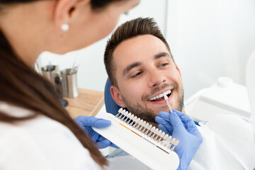 Handsome young man in stomatology clinic