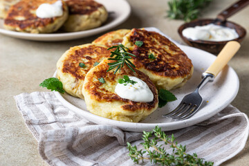 Delicious vegetable cutlets with potato and mushroom served with aromatic herbs and sauce. Healthy diet food concept. Vegan food.