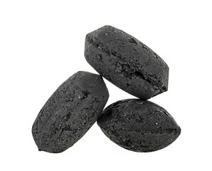 Coal briquette for BBQ isolated on a white background. Charcoal pieces.