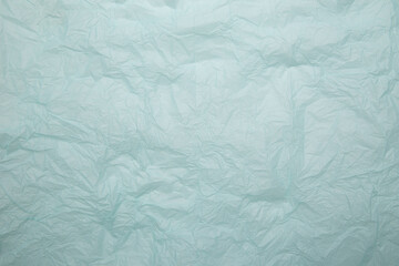 Crumpled blue paper background isolated
