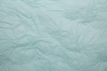 Crumpled blue paper background isolated