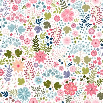 Beautiful ditsy floral seamless pattern with colorful flowers, leaves and berries on white background. Print for fabric, textile, wrapping paper.