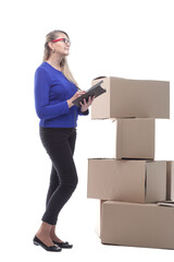 smiling woman with a clipboard to sign while standing near cardboard boxes