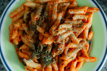 White macaroni with tomato, chilli, oregano, cheese and spices