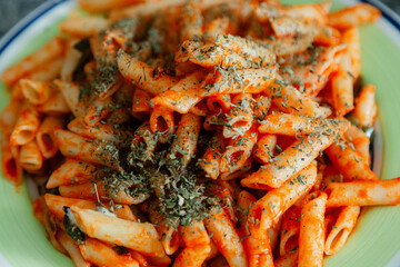 White macaroni with tomato, chilli, oregano, cheese and spices