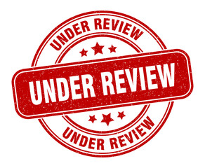 under review stamp. under review label. round grunge sign