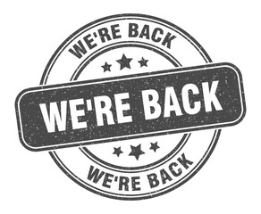 we're back stamp. we're back label. round grunge sign