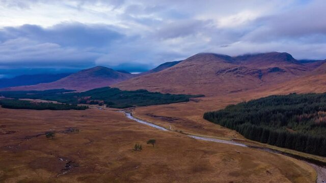 aerial drone shot over Loch Tulla in glen orchy near bridge of orchy in the argyll region of the highlands of scotland during autumn