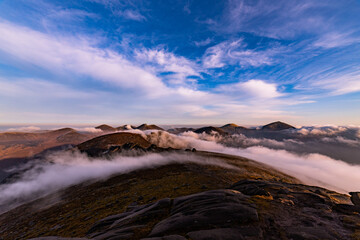 Slieve Binnian in The Mourne Mountains early morning cloud inversion, Annalong, County Down,...