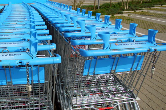 Amsterdam, The Netherlands - March 22, 2018: Row of blue Albert Heijn shopping carts or trolleys. Albert Heijn is the largest Dutch supermarket chain.