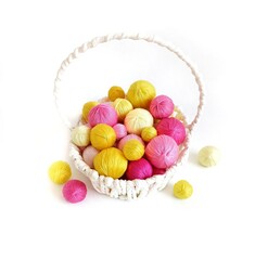 Pink and yellow balls of yarn for hand knitting.