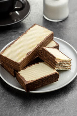 Crispy wafer biscuits filled with chocolate cream.