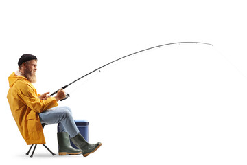 Full profile length shot of a fisherman on a chair pulling a fishing rod