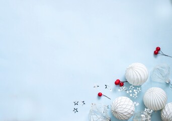 christmas decorations on light blue background image with copy space