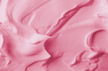 Obraz na płótnie Canvas Cosmetic mousse foam texture background. Pink color creamy product swatch