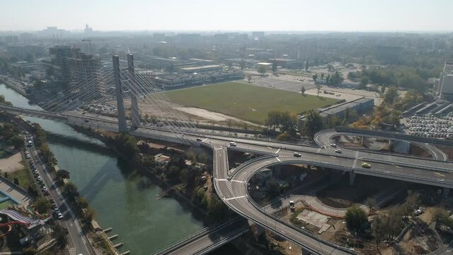 Aerial footage of a suspended bridge in Bucharest on a sunny day