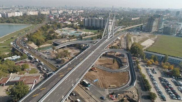 Aerial footage of a suspended bridge in Bucharest on a sunny day