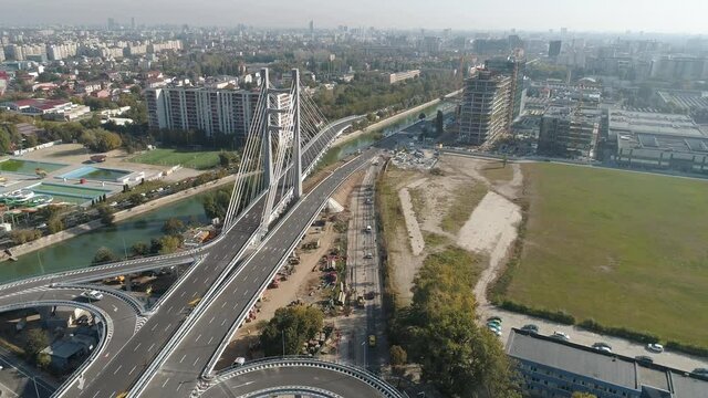 Aerial footage of a suspended bridge in Bucharest on a sunny day