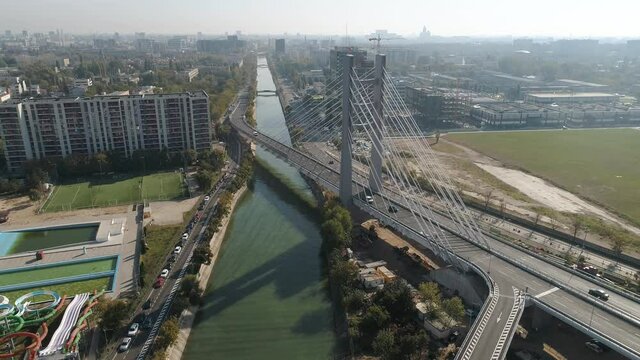 Aerial footage of a suspended bridge in Bucharest on a sunny day