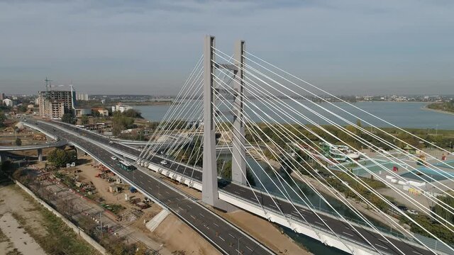 Aerial footage of a suspended bridge in Bucharest on a sunny day