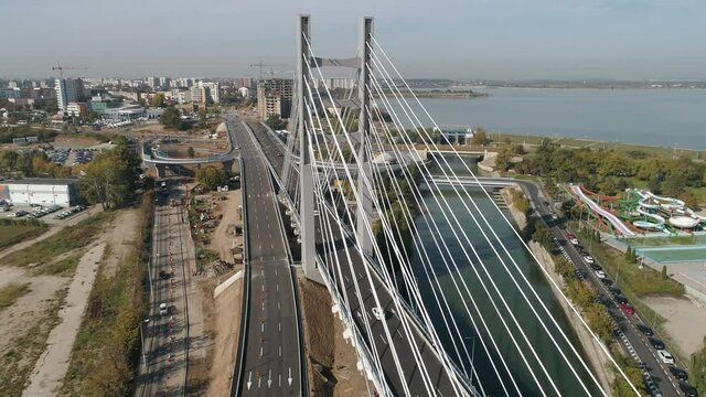Aerial footage of a suspended bridge in Bucharest on a sunny day