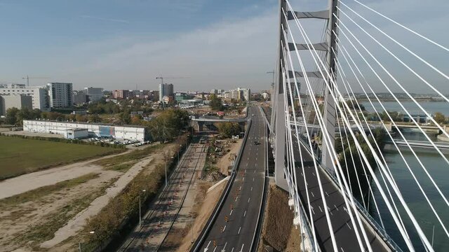 Aerial footage of a suspended bridge in Bucharest on a sunny day
