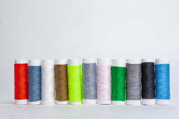 Colourful thread spools isolated on a white