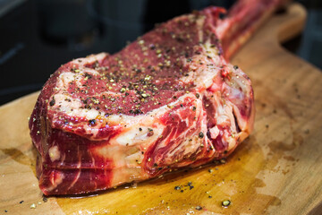 Raw Dry Aged Barbecue Tomahawk Steak ready for grill