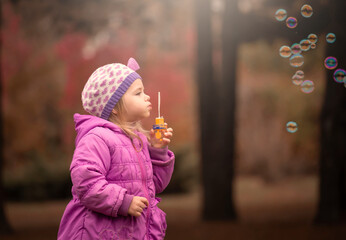  Girl, garden, lilac coat, soap bubble blower