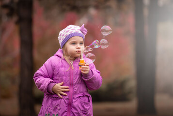  Girl, garden, lilac coat, soap bubble blower