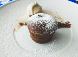 Isolated chocolate coulant with vanilla ice cream